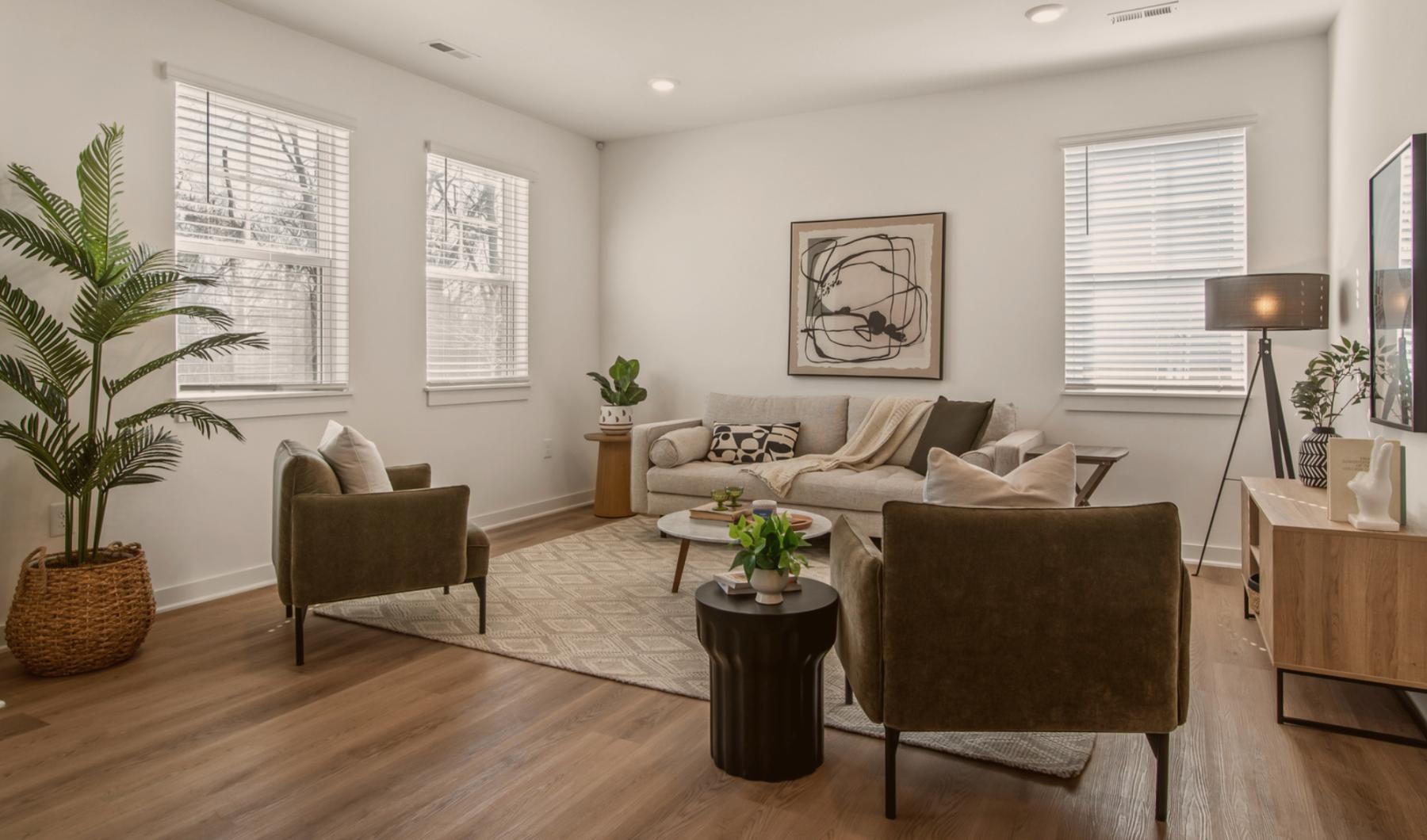 Settle into comfort at The Harris The Harris townhome living room with a couch and chairs