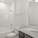 Bathroom with a tub sink and toilet at townhomes at The Harris