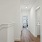 Hallway leading to bedroom and laundry room in townhome at The Harris
