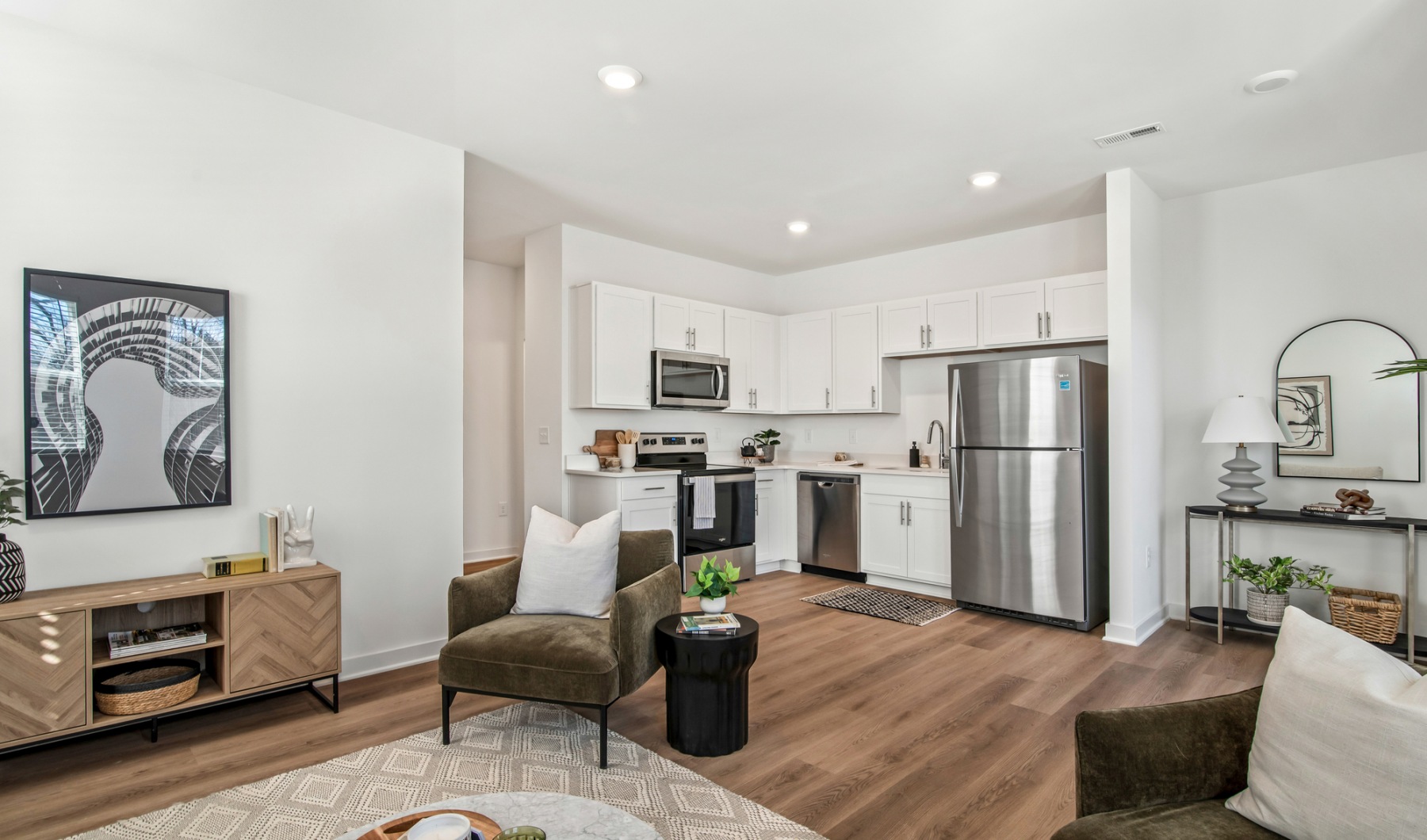 Find your perfect fit at The Harris Furnished towhome living room and kitchen at The Harris