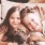 Lifestyle photo of a couple of children lying on a couch with a cat and a dog