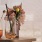 Lifestyle photo of a couple of vases with flowers