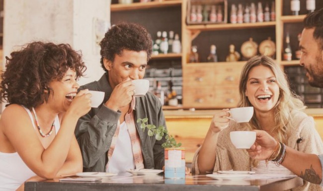 Bustling community with plenty of dining choices Lifestyle photo of a group of people sitting around a table