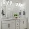 Double vanities and modern townhome bathroom with white cabinets at The Harris