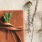 Brown leather book with a ribbon and a pen on a white surface