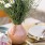 Lifestyle photo of a vase with white flowers
